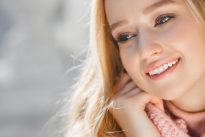 Close up portrait of young beautiful woman outdoors